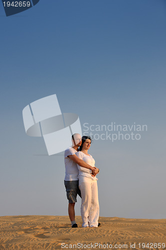 Image of couple enjoying the sunset