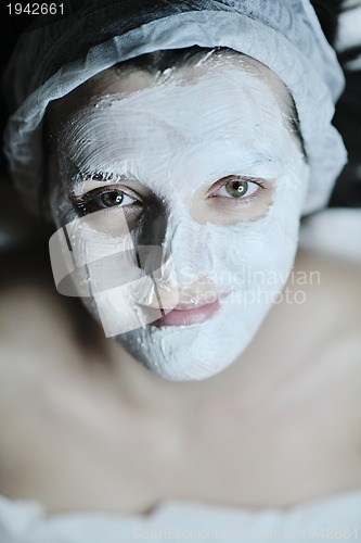 Image of woman with facial mask in cosmetic studio