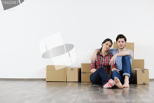 Image of Young couple moving in new house