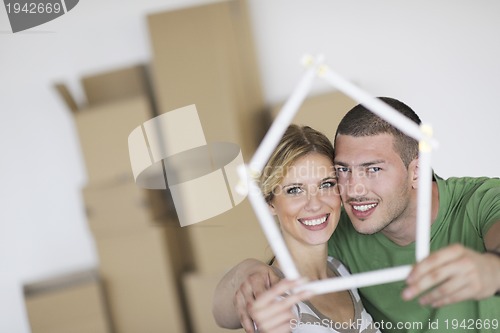 Image of Young couple moving in new home