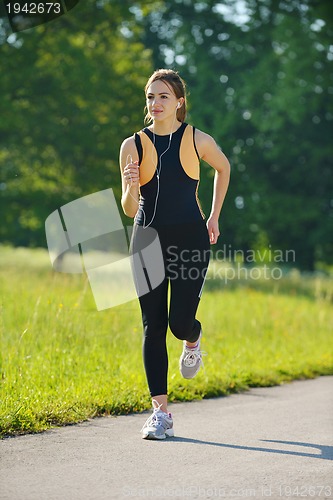 Image of Young couple jogging at morning