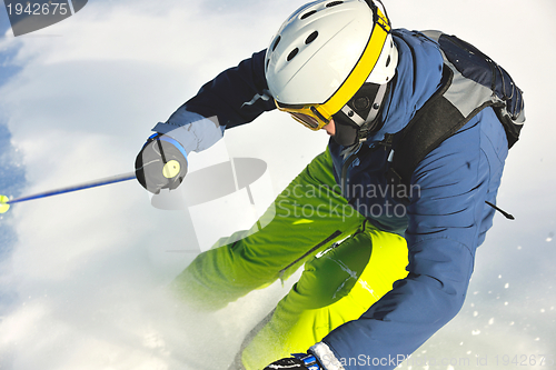 Image of skiing on fresh snow at winter season at beautiful sunny day