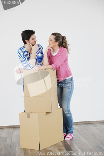 Image of Young couple moving in new home