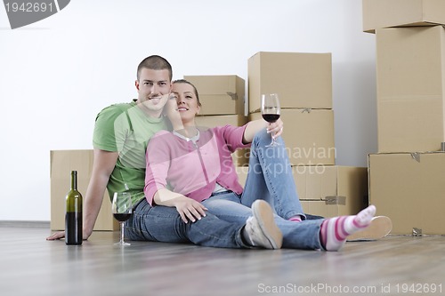 Image of Young couple moving in new home