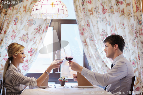 Image of young couple having dinner at a restaurant