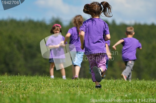 Image of happy kids group  have fun in nature