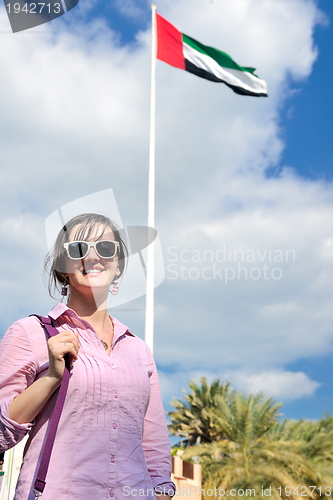 Image of happy tourist woman