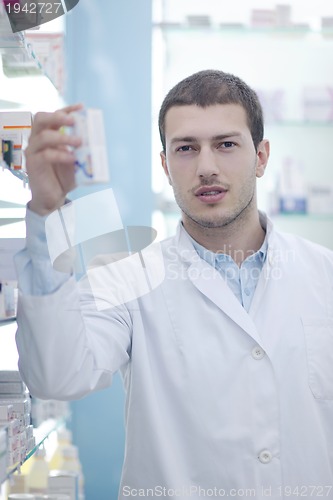 Image of pharmacist chemist man in pharmacy drugstore