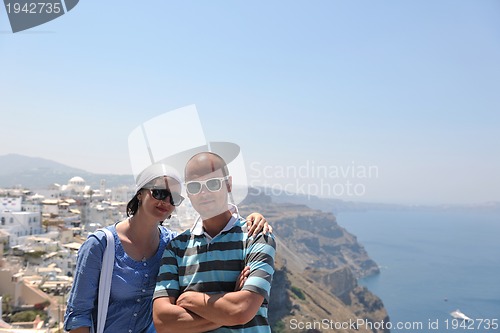 Image of happy young couple tourists in greece