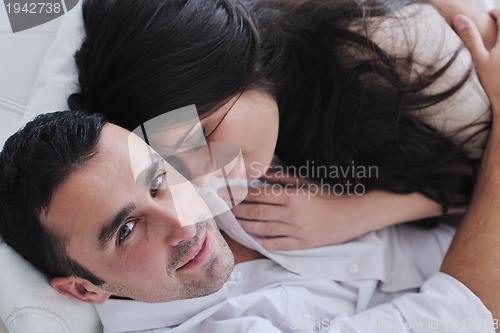 Image of happy young couple relax at home