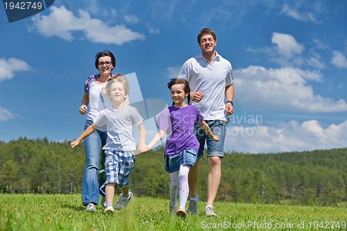 Image of happy young family have fun outdoors