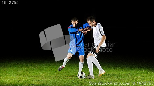 Image of football players in action for the ball