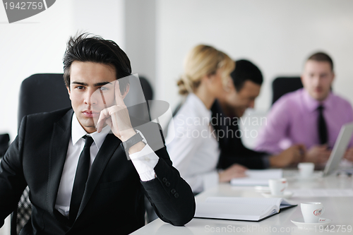 Image of young business man at meeting