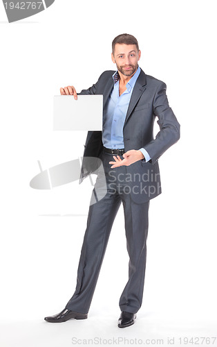 Image of Full length portrait businessman showing an empty board to write