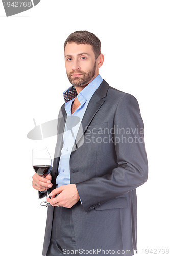 Image of Portrait of thoughtful business man with glass wine