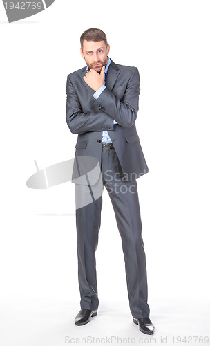 Image of Full length portrait of thoughtful business man