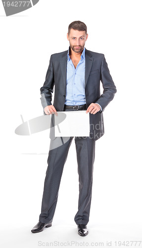Image of Full length portrait businessman showing an empty board to write