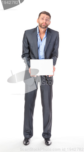 Image of Full length portrait businessman showing an empty board to write