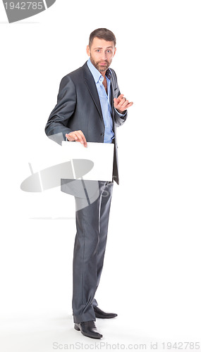Image of Full length portrait businessman showing an empty board to write