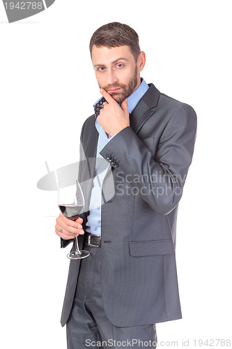 Image of Portrait of thoughtful business man with glass wine