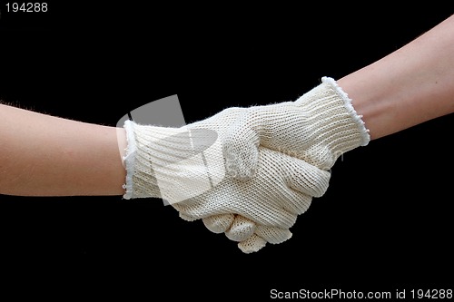 Image of Labor handshake with safety gloves isolated on black