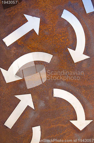 Image of Rusty turn arrow signs