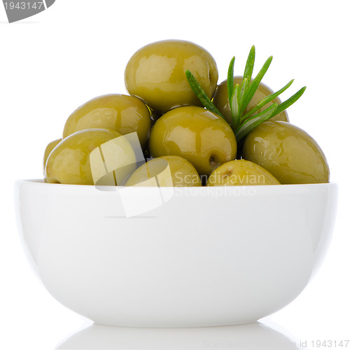 Image of Green olives in a white ceramic bowl