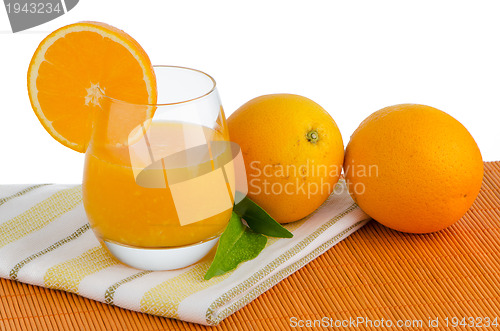 Image of Cup of orange juice and fresh orange