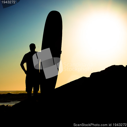 Image of Long boarder watching the waves