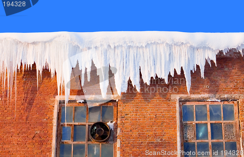 Image of Snow cover on roof of old textile fabric with icicles