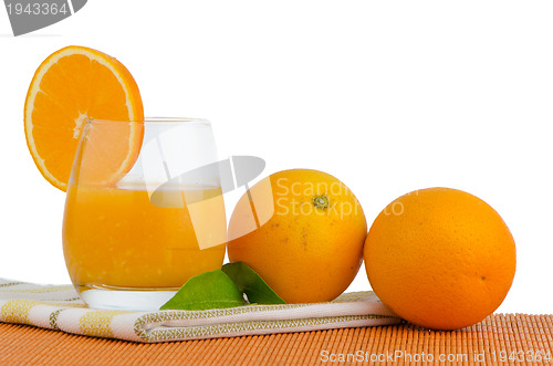 Image of Cup of orange juice and fresh orange