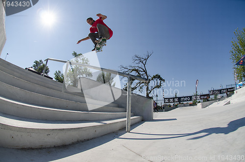 Image of Andre Pereira flying over the stairs