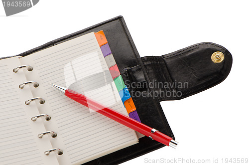 Image of Note book and pencil
