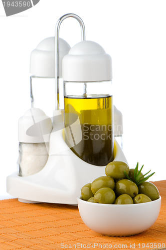 Image of Green olives in a white ceramic bowl