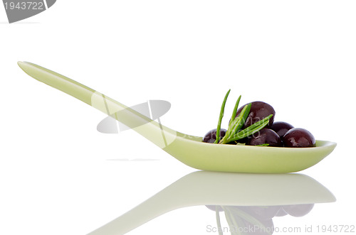 Image of Olives on ceramic spoon