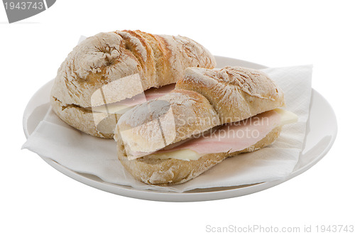 Image of White plate of ham and cheese sandwiches
