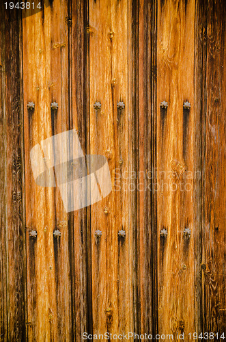 Image of Weathered wooden door texture background 