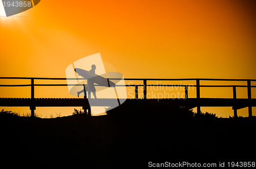 Image of Surfer running to the beach