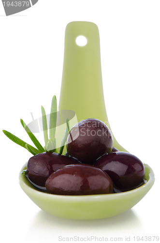 Image of Olives on ceramic spoon