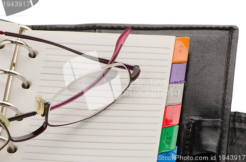 Image of Leather notebook and glasses