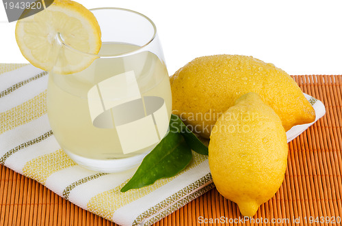 Image of Cup of lemon juice and fresh lemons
