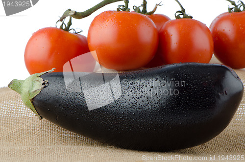 Image of Eggplant and cherry tomatoes vine