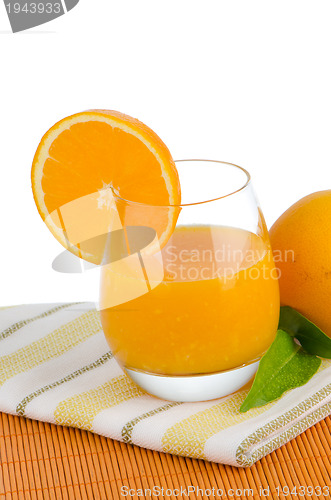 Image of Cup of orange juice and fresh orange