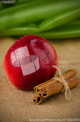 Image of Peach  and cinnamon sticks