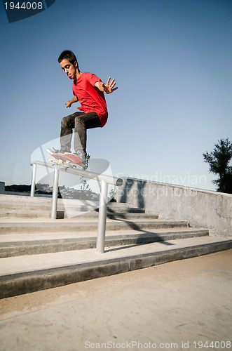 Image of Skateboarder on rail 