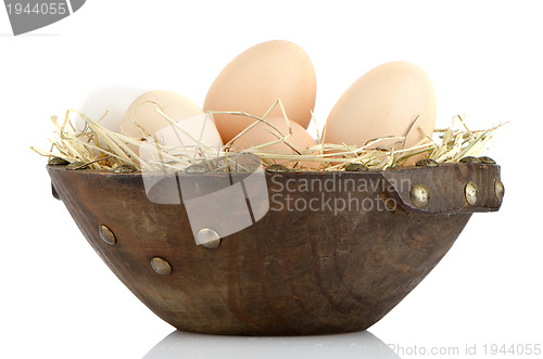 Image of Eggs on wood bowl