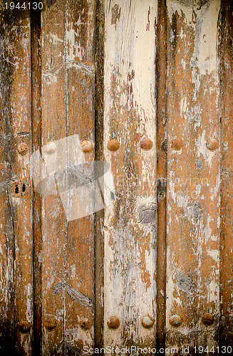 Image of Weathered wooden door texture background 