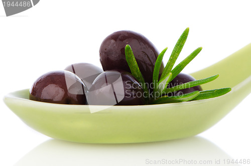 Image of Olives on ceramic spoon