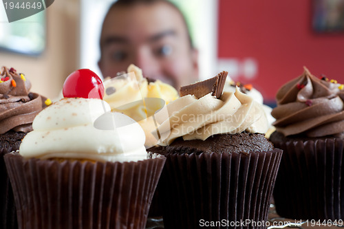 Image of Man Looking at Cupcakes