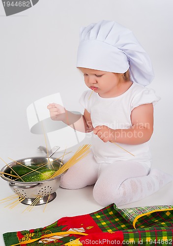 Image of baby girl in the cook hat